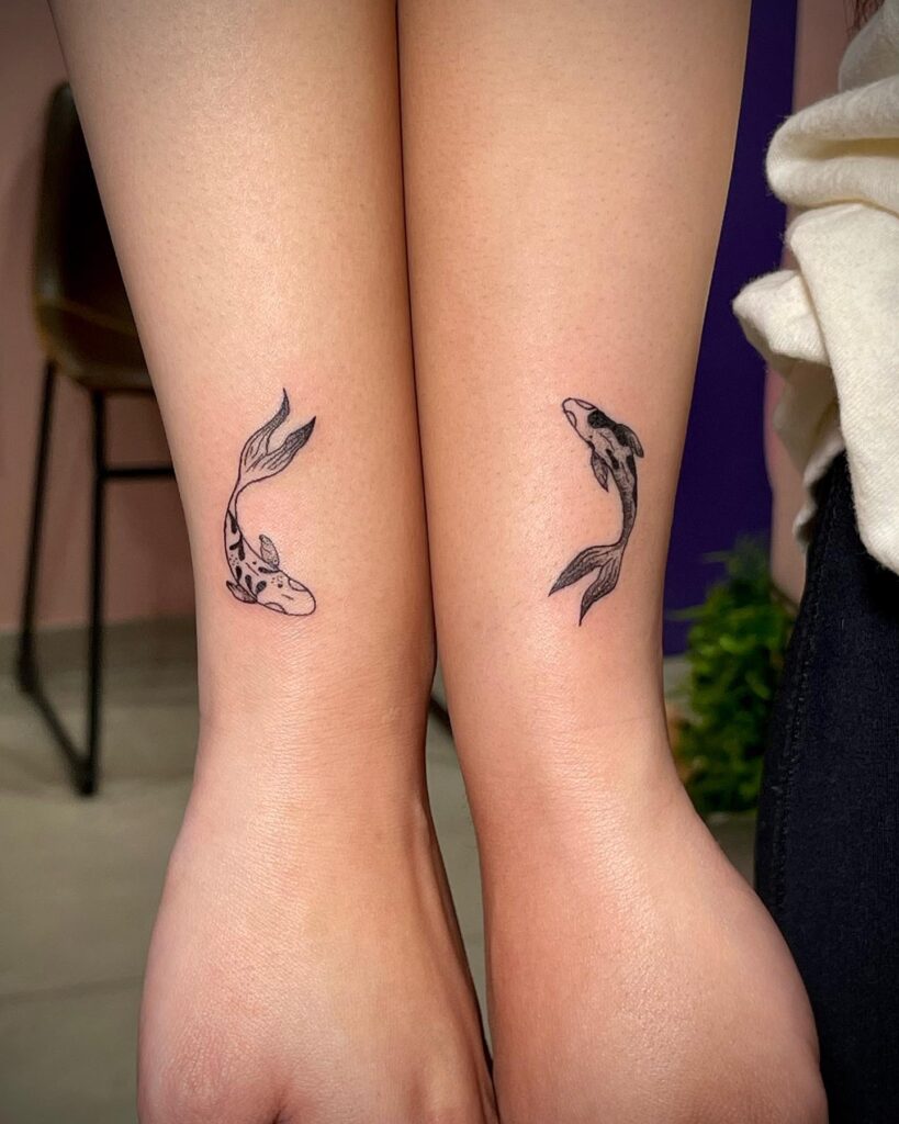 Swimming Yin and Yang Koi Fish matching sibling tattoo