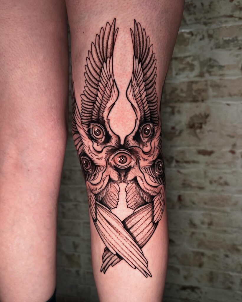 Symmetrical Seraphim Calf Tattoo with Vertical Wings seraphim angel tattoo ideas tattoo