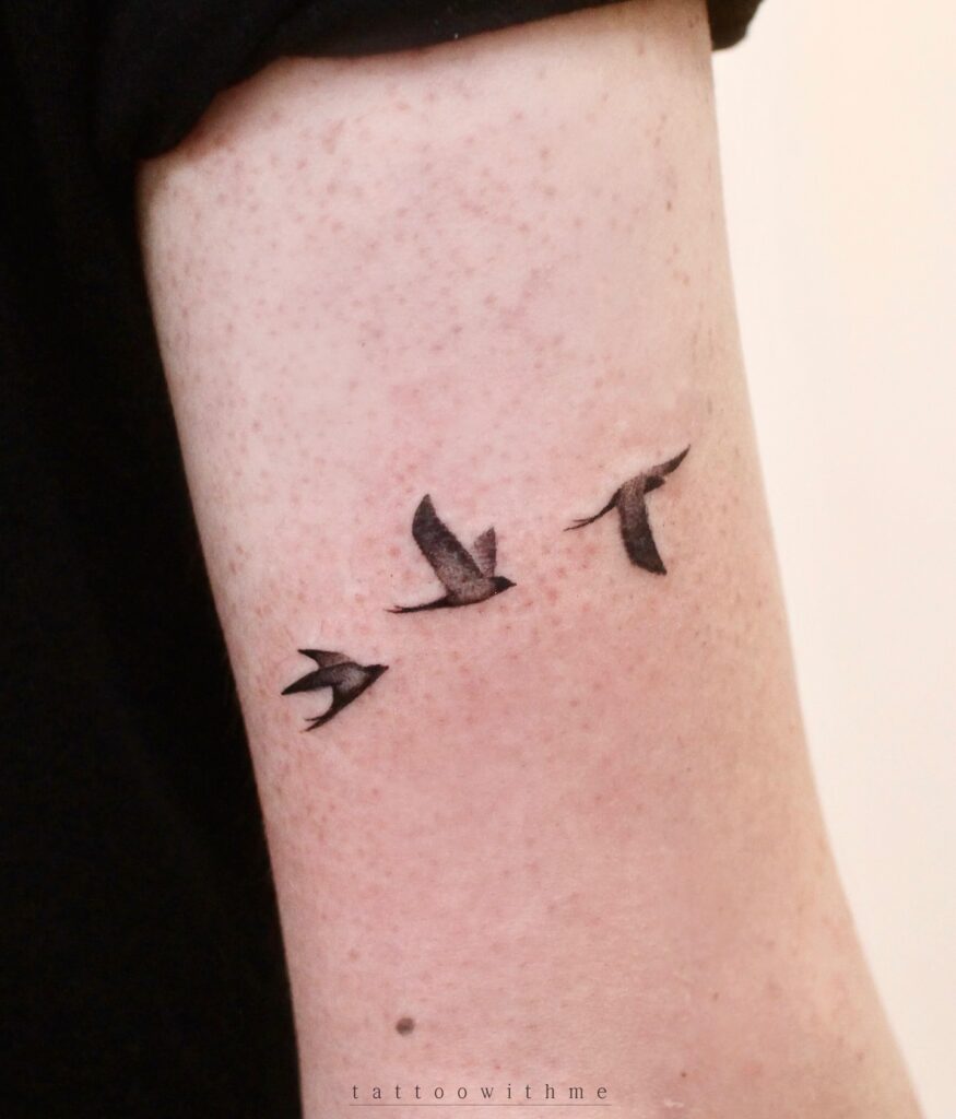 Three Flying Birds Minimal Tattoo bird tattoo ideas for women with meaning tattoo