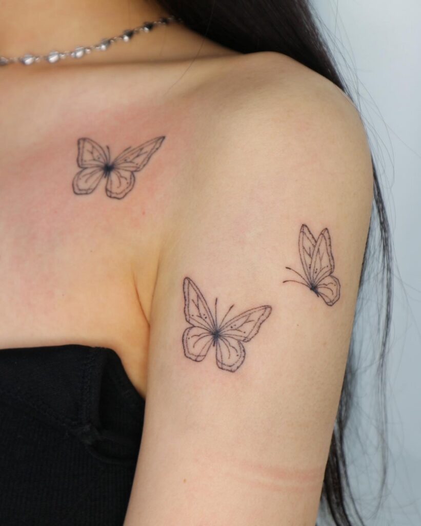 Three Micro Butterflies in Spiral Flight butterfly tattoo