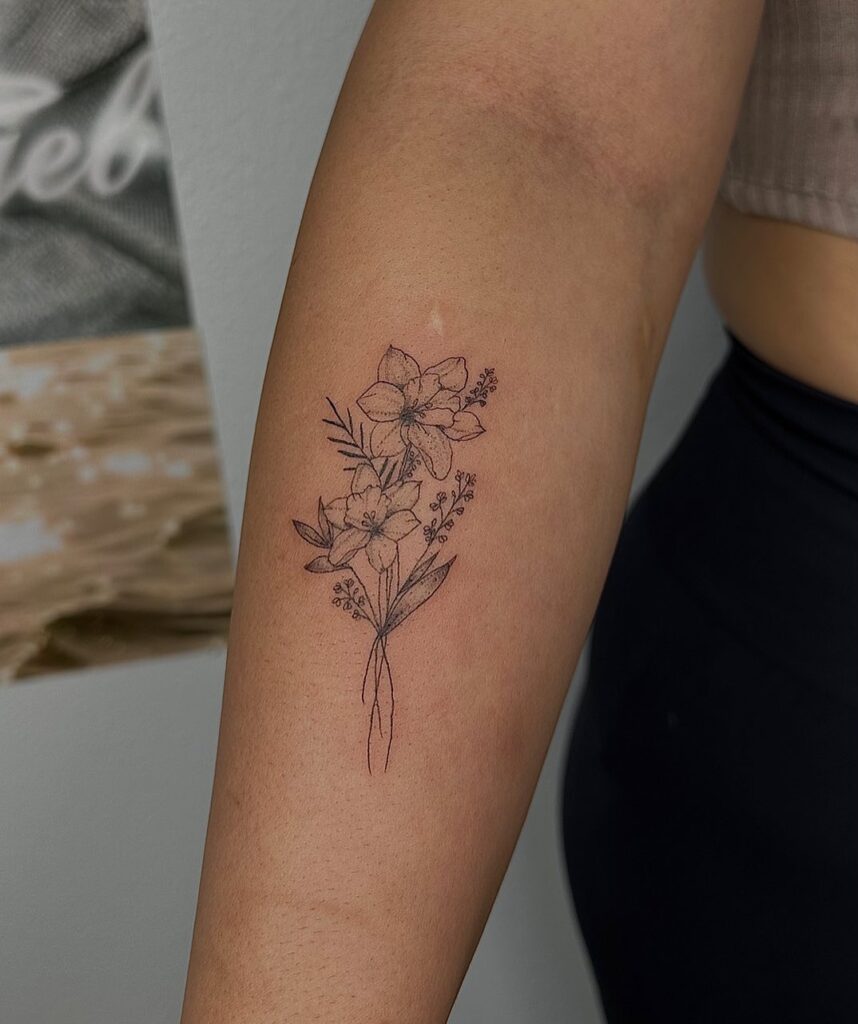 Tied Narcissus Bouquet Tattoo with Fine Details december birth flower tattoo ideas tattoo
