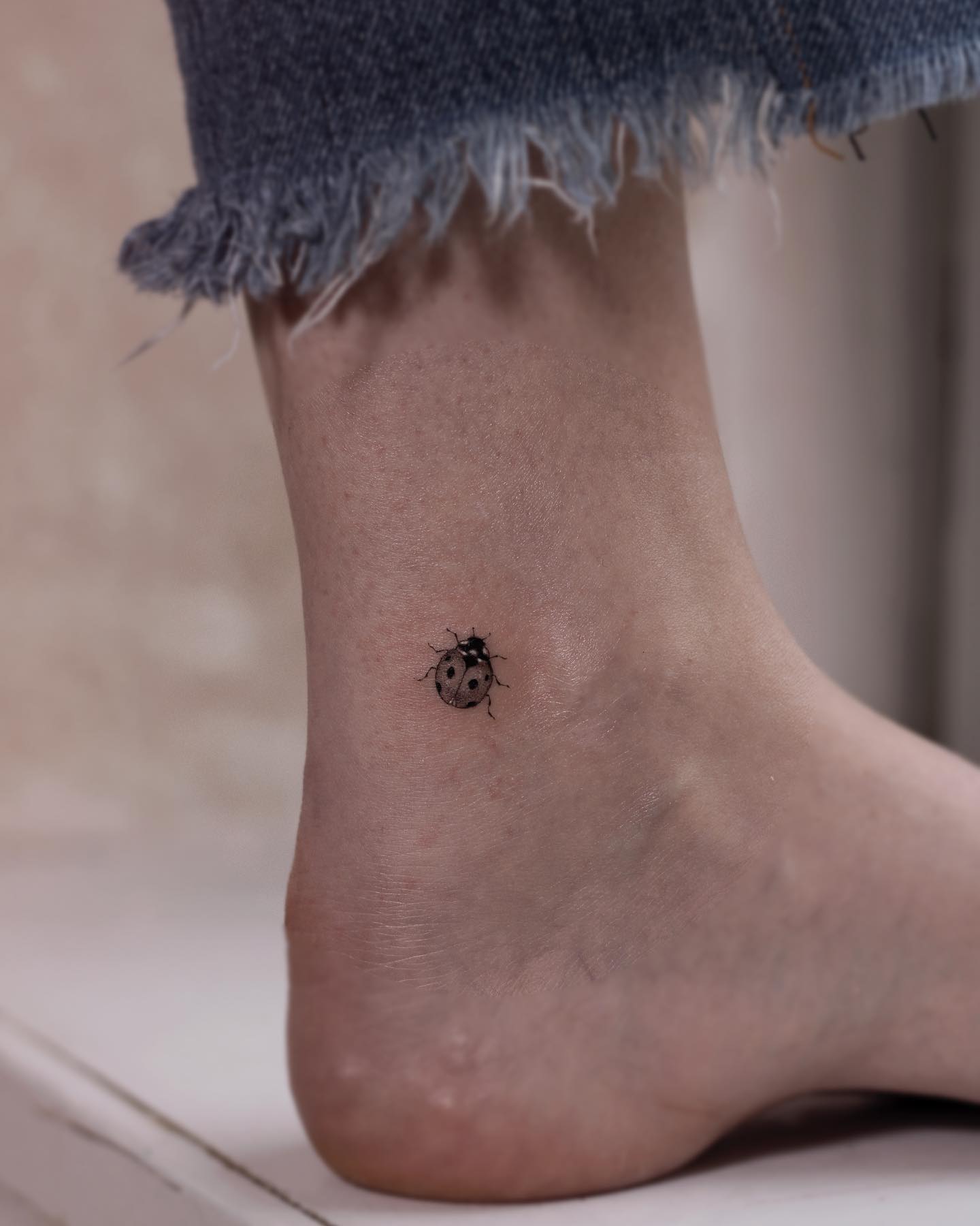 Minimalist Ladybug Tattoo On The Arm