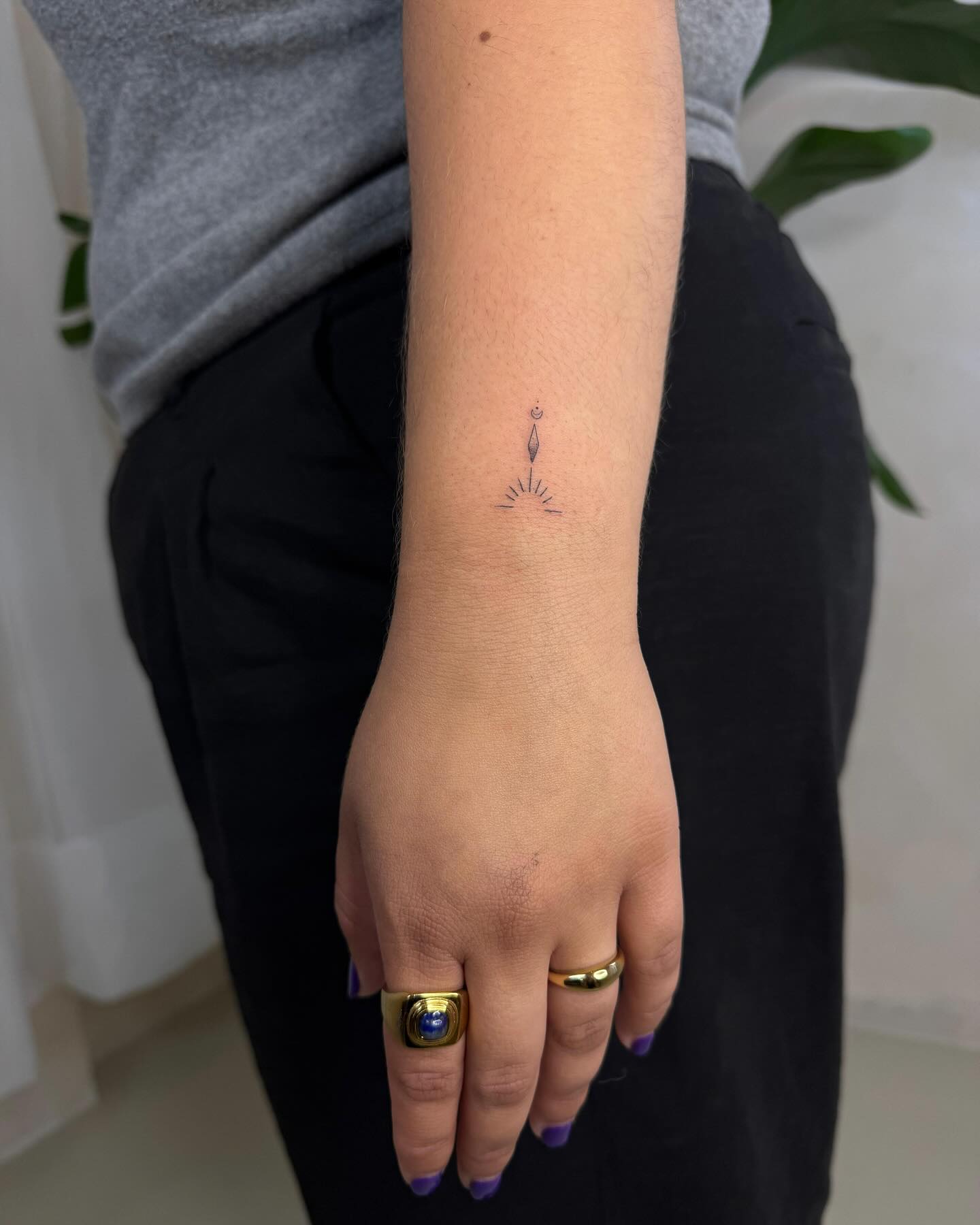 Tiny Airplane Wrist Tattoo