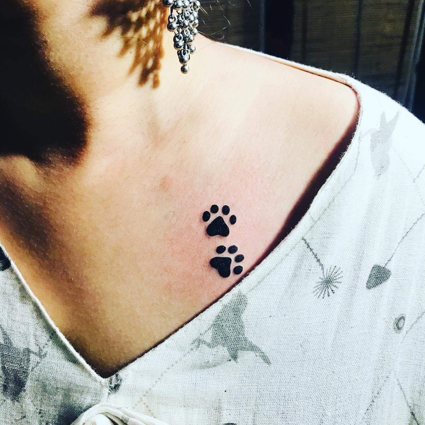 Tiny Collarbone Dog Paw Tattoo dog paw tattoos tattoo