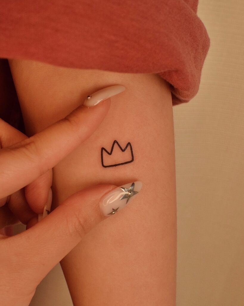 Tiny Crown Outline Tattoo meaningful tiny tattoos tattoo