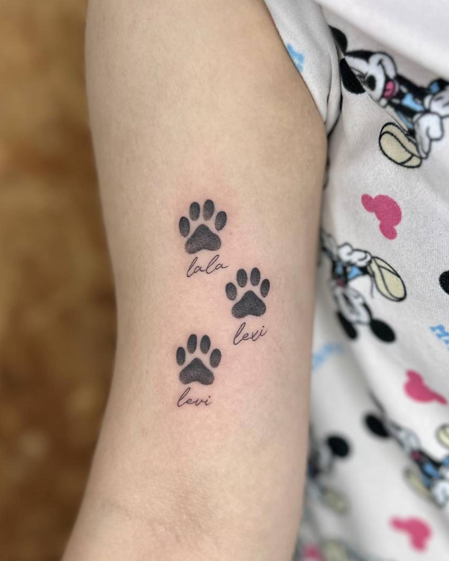 Tiny Dog Paw and Name Tattoo dog paw tattoos tattoo