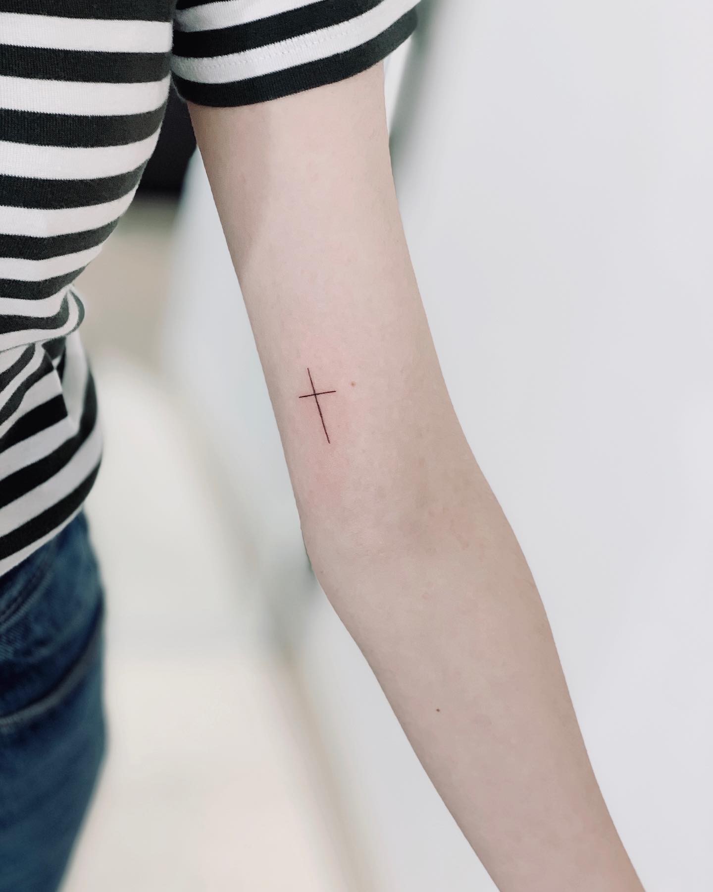 Tiny Fine Line Cross Tattoo cross tattoos ideas for women tattoo