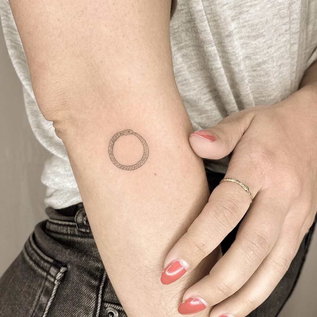 Vibrant Neo-Traditional Ouroboros Tattoo