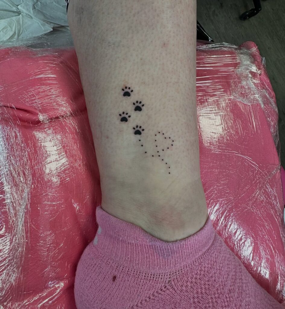 Tiny Paw Prints with Dotted Heart Tattoo paw print tattoo ideas tattoo
