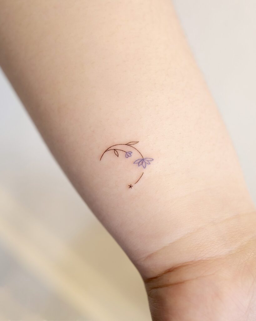 Tiny Purple Bellflowers and Star Tattoo meaningful tiny tattoos tattoo