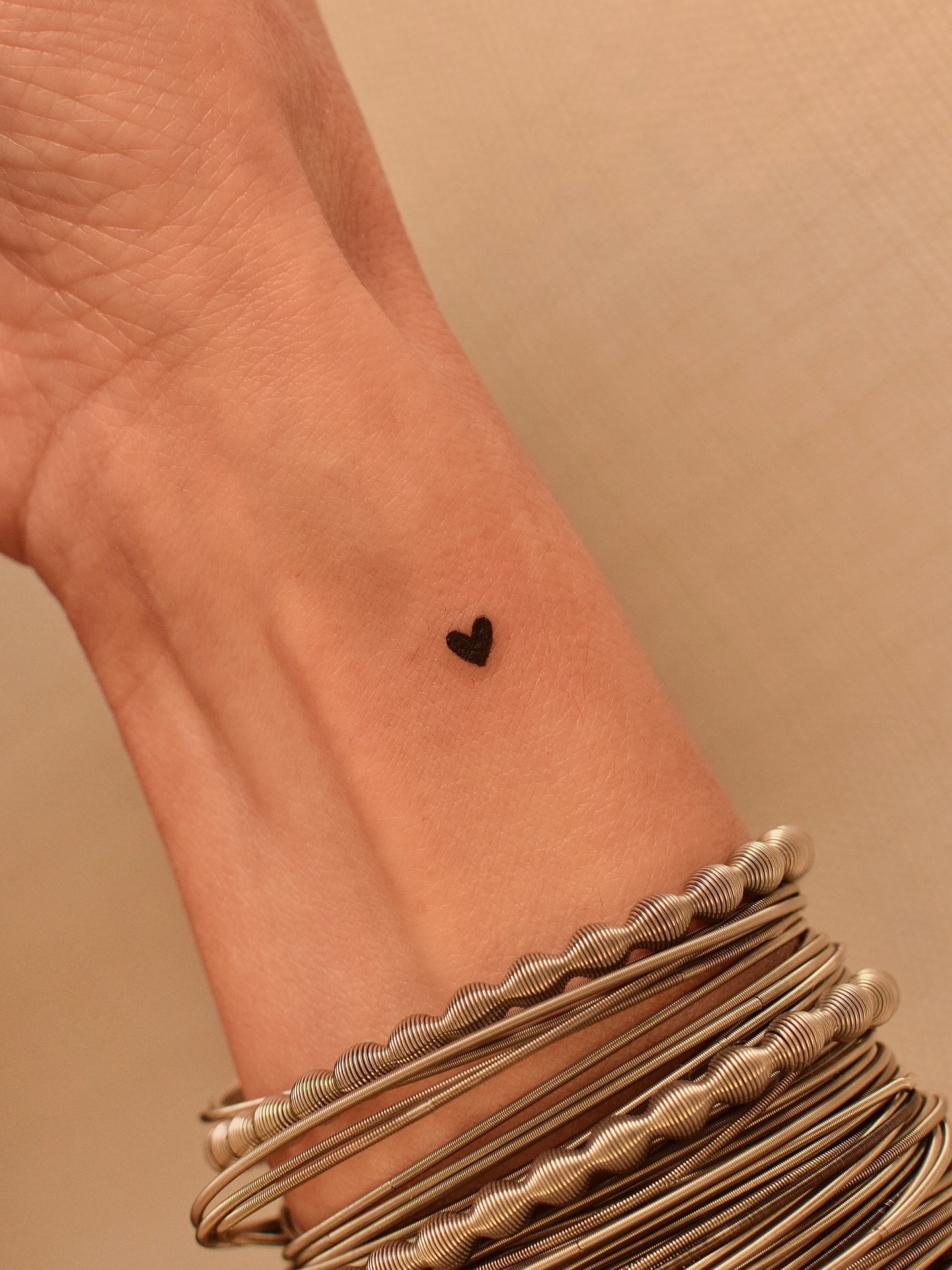 Tiny Red Heart Wrist Tattoo