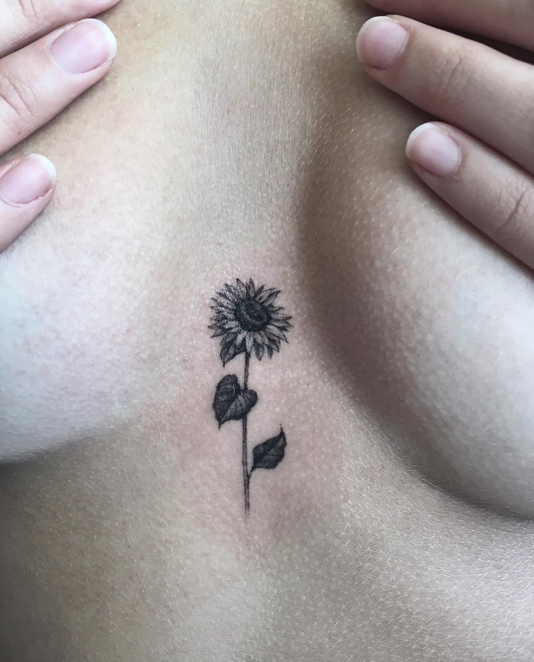 Tiny Sternum Sunflower Tattoo small sunflower tattoos ideas tattoo