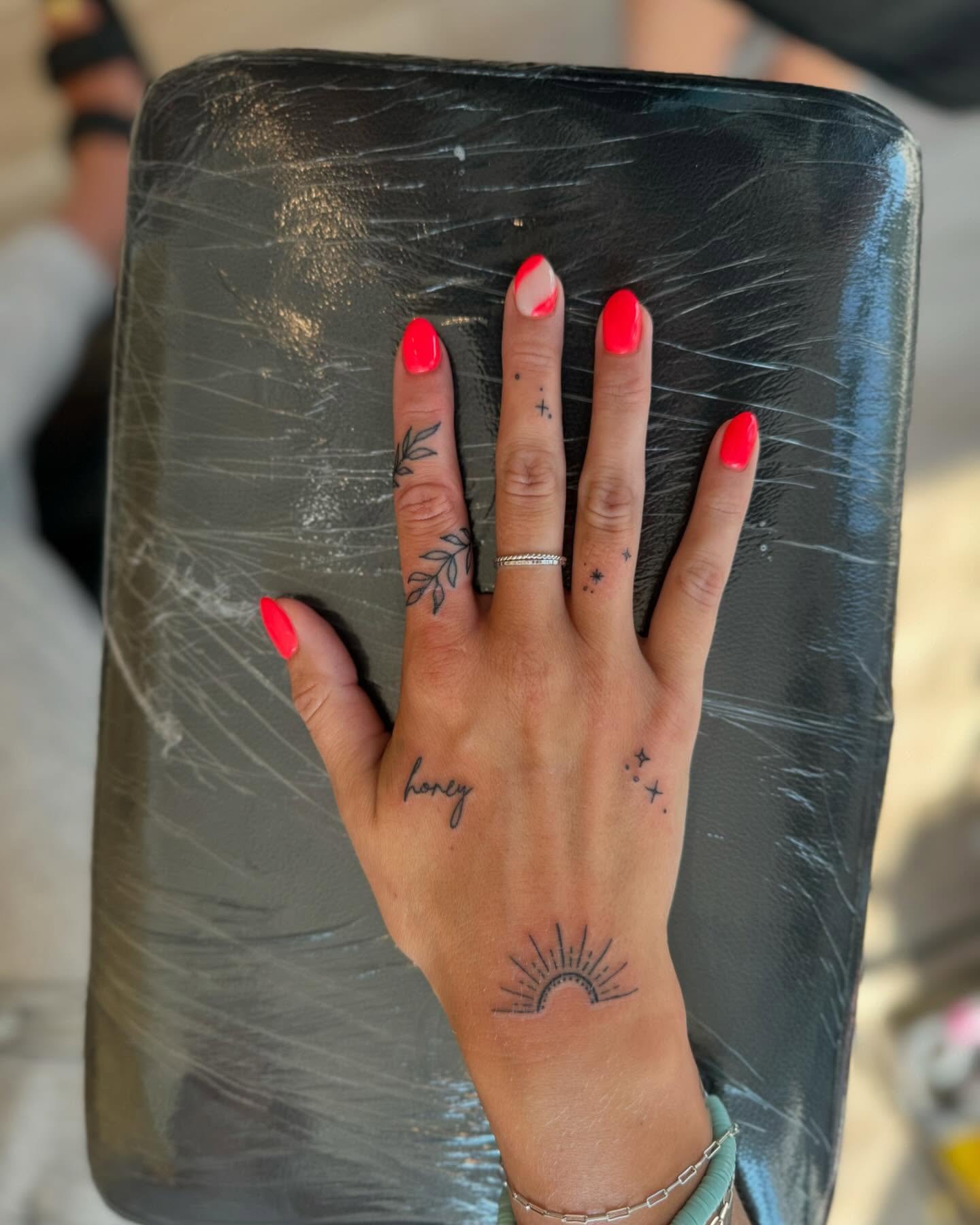 Tiny Sun And Finger Tattoos
