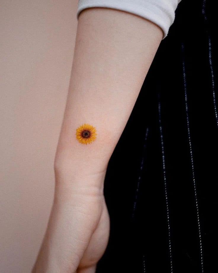 Tiny Sunflower Tattoo on the Arm sunflower tattoos tattoo