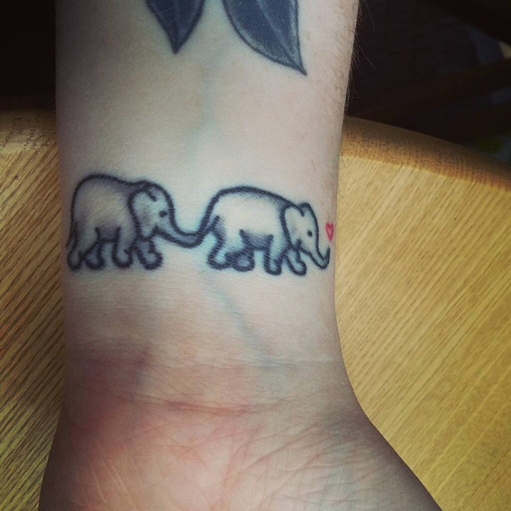 Tiny Wrist Elephants with Heart Tattoo elephant family tattoo ideas tattoo