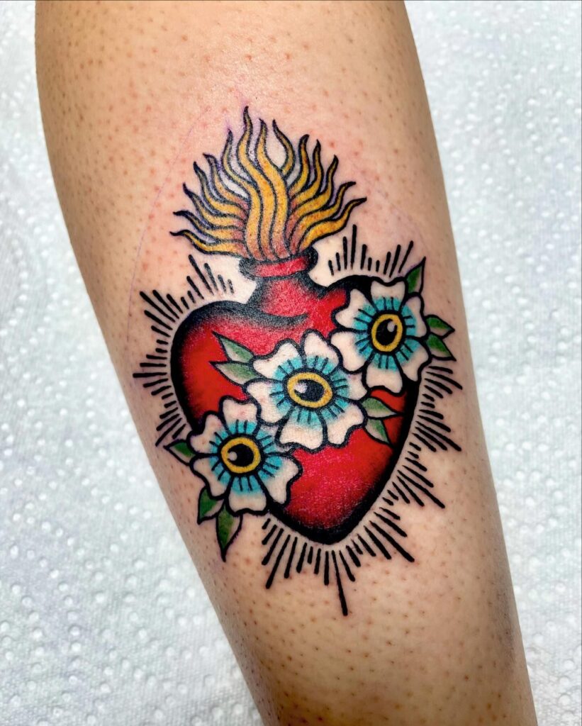 Sacred Heart with Sword and Radiant Rays Tattoo sacred heart tattoo ideas tattoo