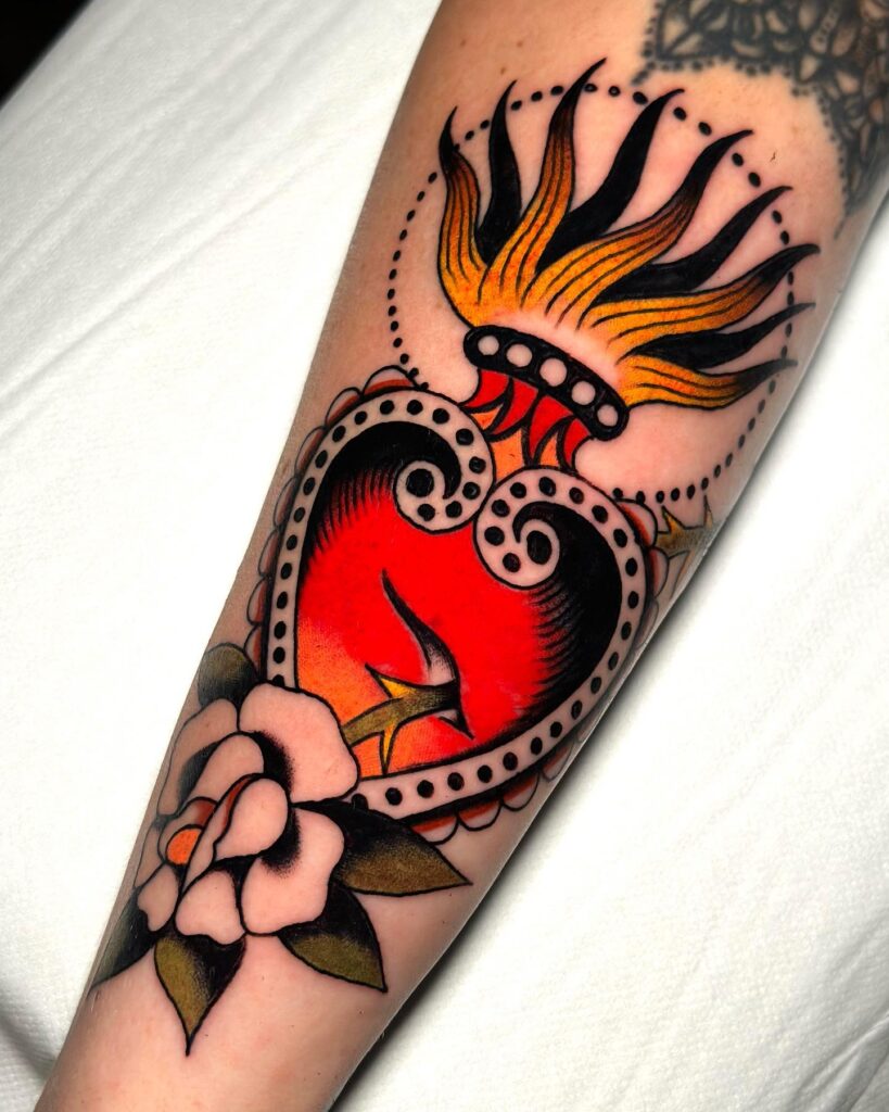 Minimalist Sacred Heart Tattoo with Flame Design sacred heart tattoo ideas tattoo