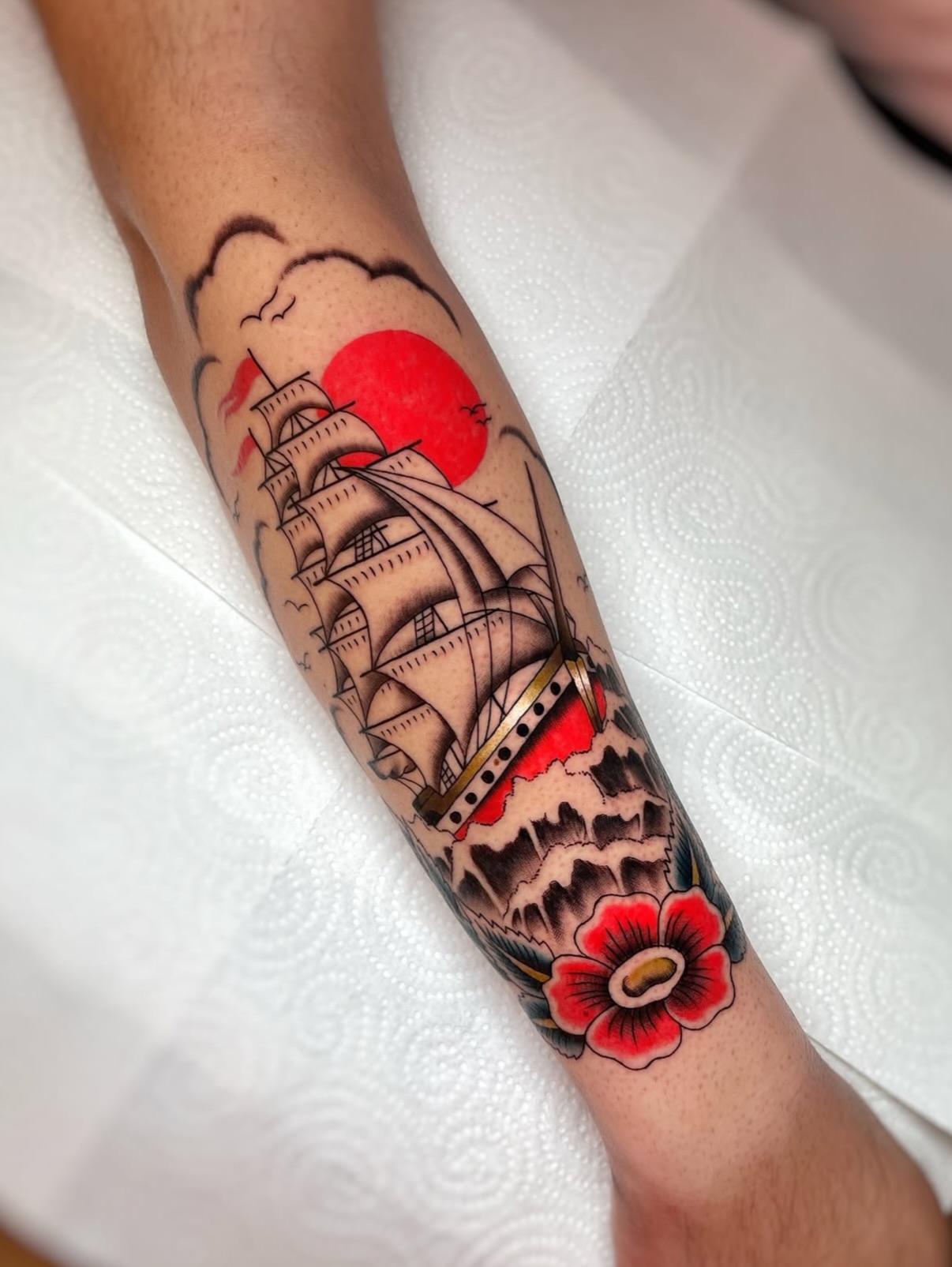 Traditional Ship And Floral Frame Tattoo