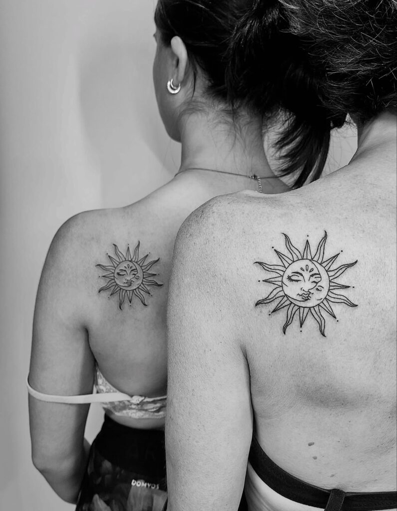 Classic shoulder sun and moon tattoos with ornamental rays