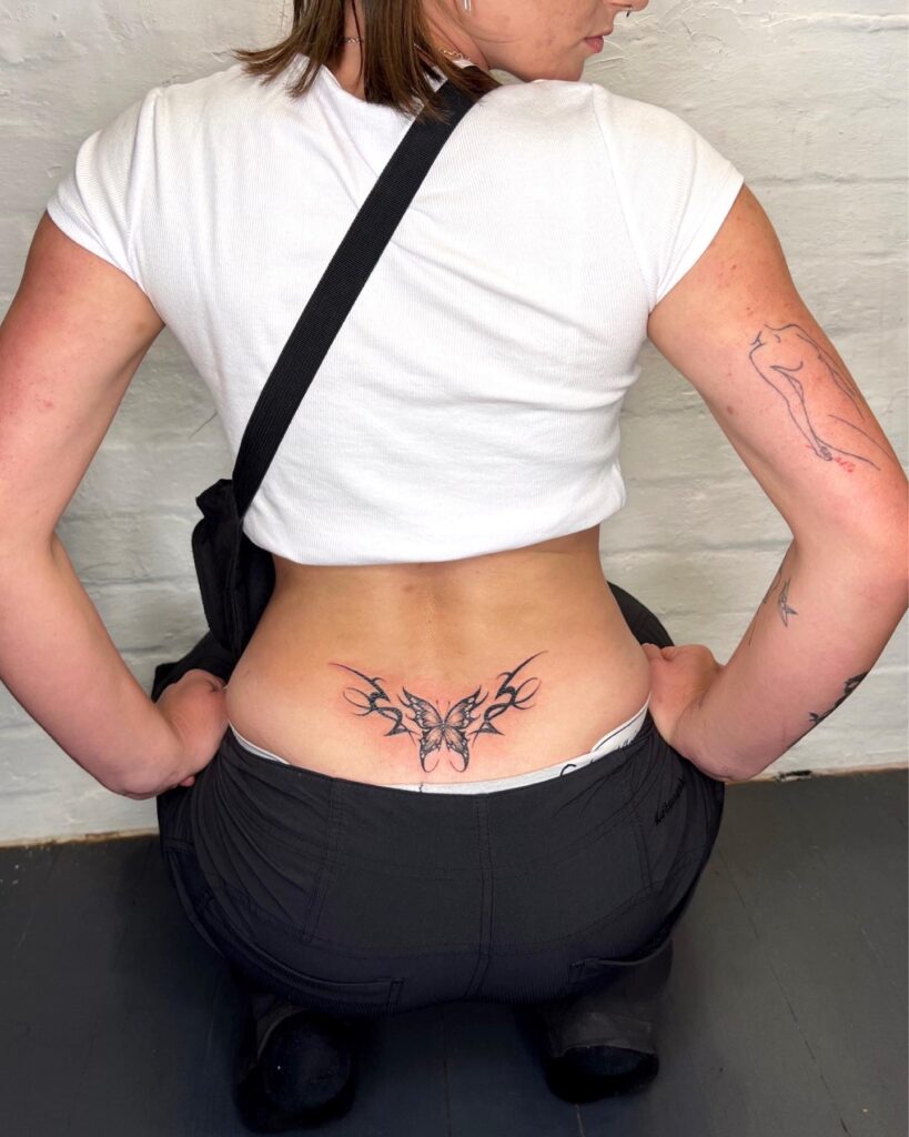 Red And Black Tribal Heart Lower Back Tattoo