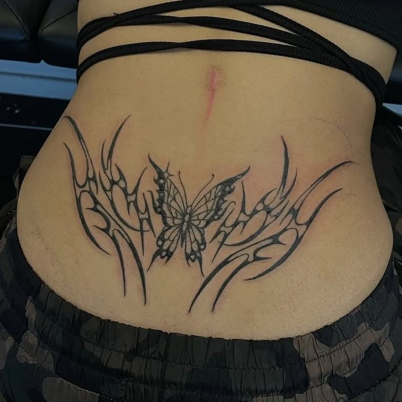 Red And Black Tribal Heart Lower Back Tattoo