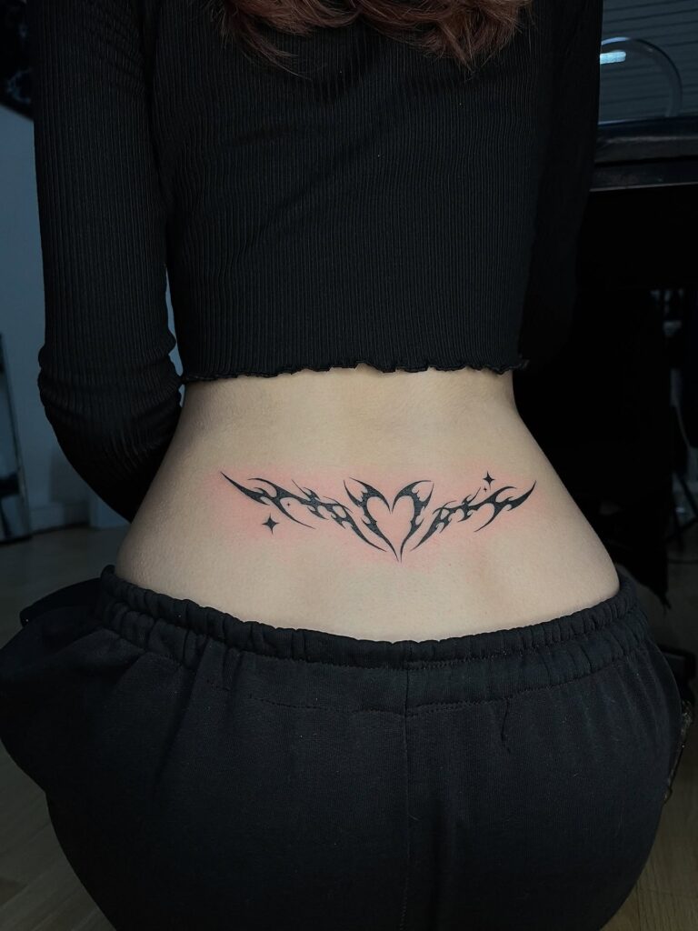 Shaded Tribal Heart Lower Back Tattoo