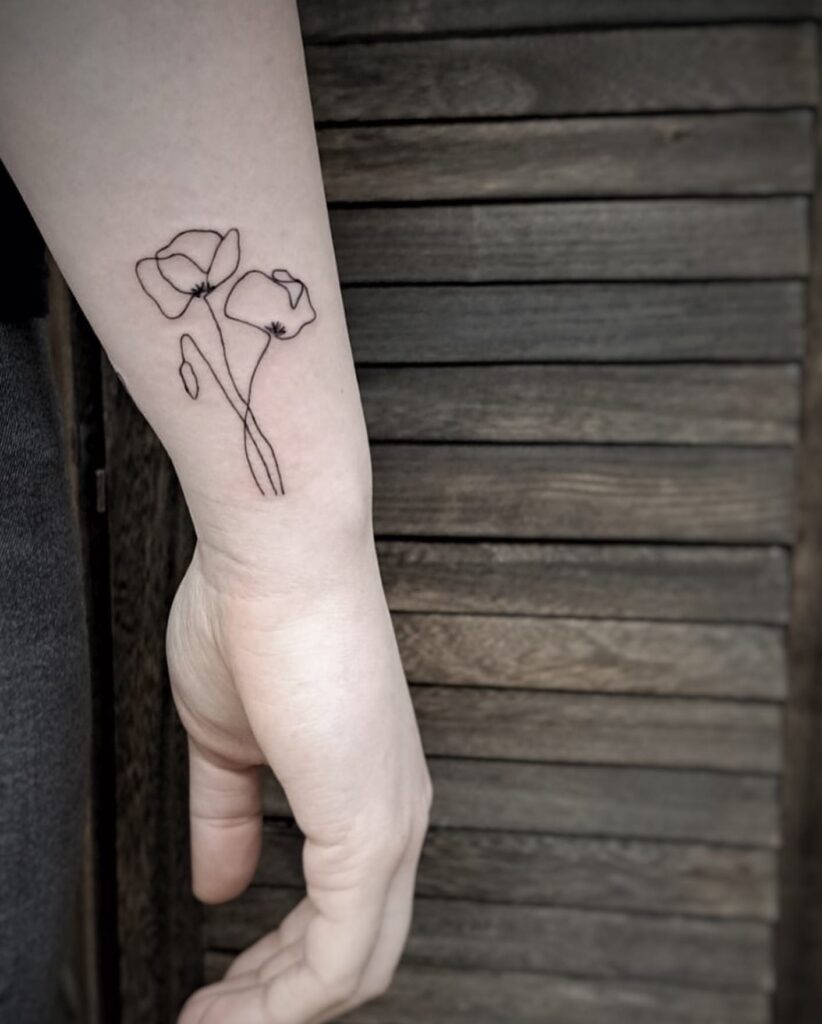 One line poppy flowers tattoo