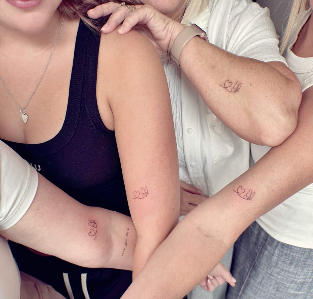 Twin Hearts with Fluttering Butterfly matching family tattoo