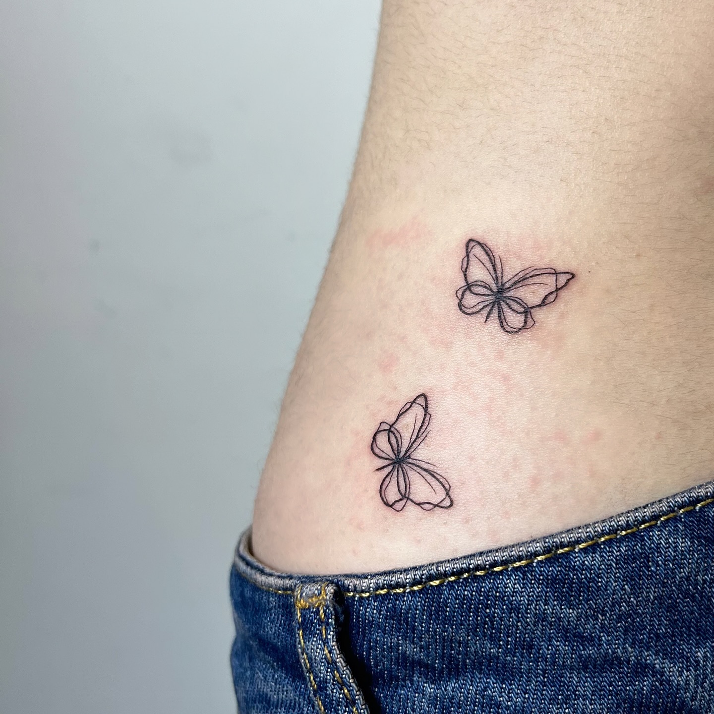 Two Fine Line Butterfly Hip Tattoo butterfly tattoos designs tattoo