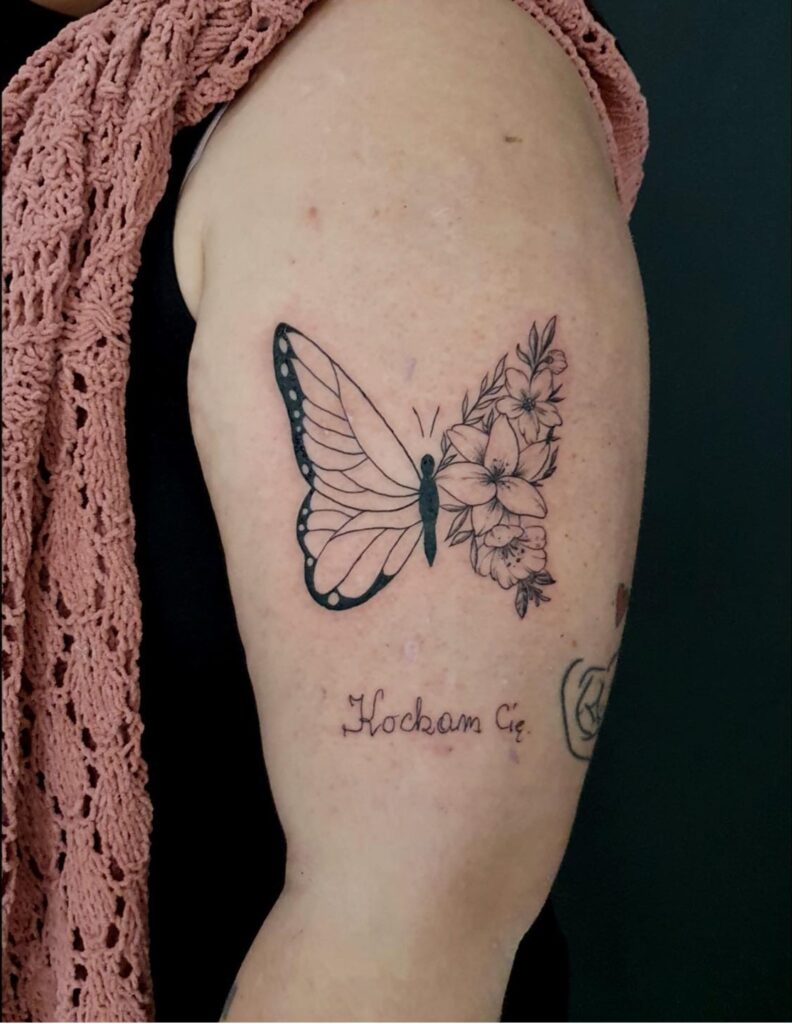 Upper Arm Butterfly and Floral Tribute Tattoo half butterfly half flower tattoos tattoo