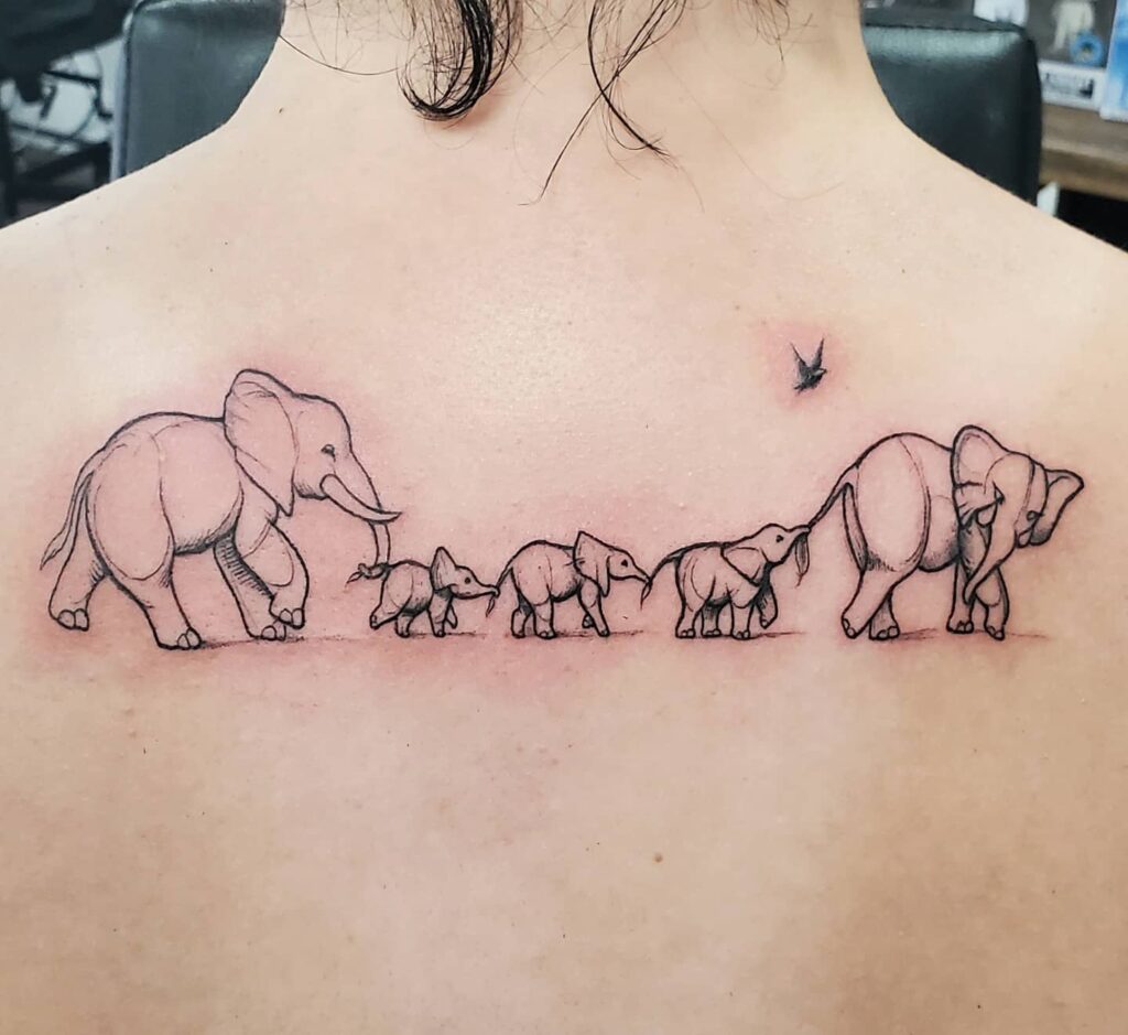 Upper Back Elephant Family Chain Tattoo elephant family tattoo ideas tattoo
