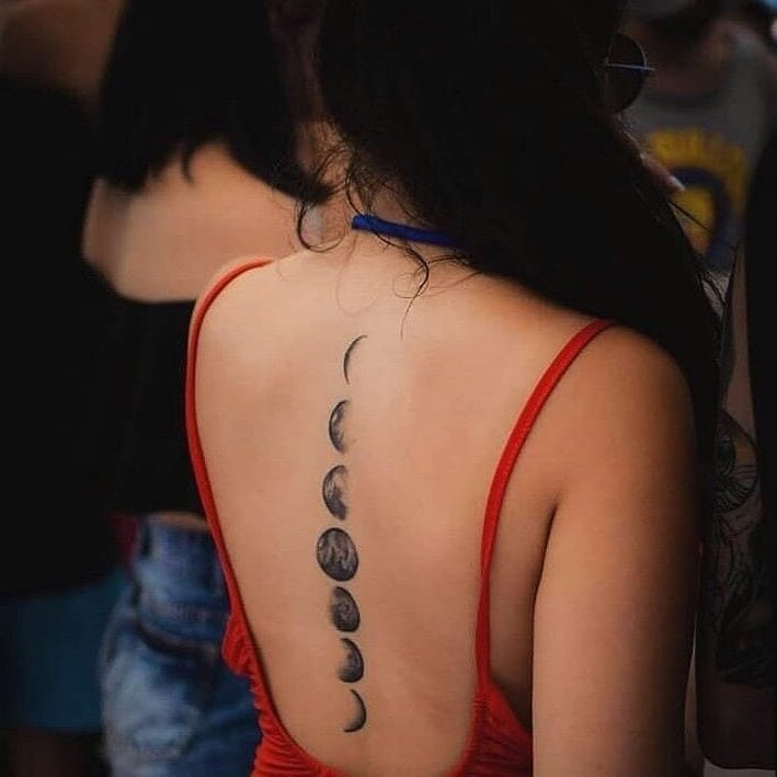 Upper back moon phases tattoo
