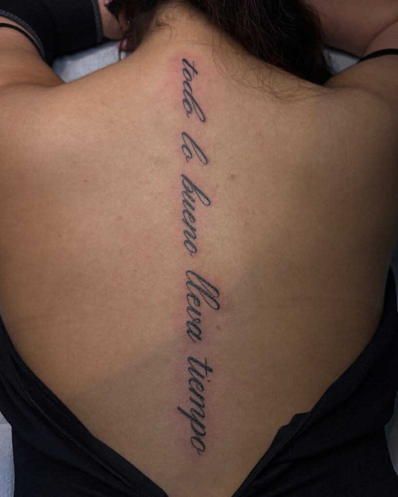 Vertical Back Script Tattoo – “Todo lo bueno lleva tiempo” meaningful quote tattoos for women tattoo