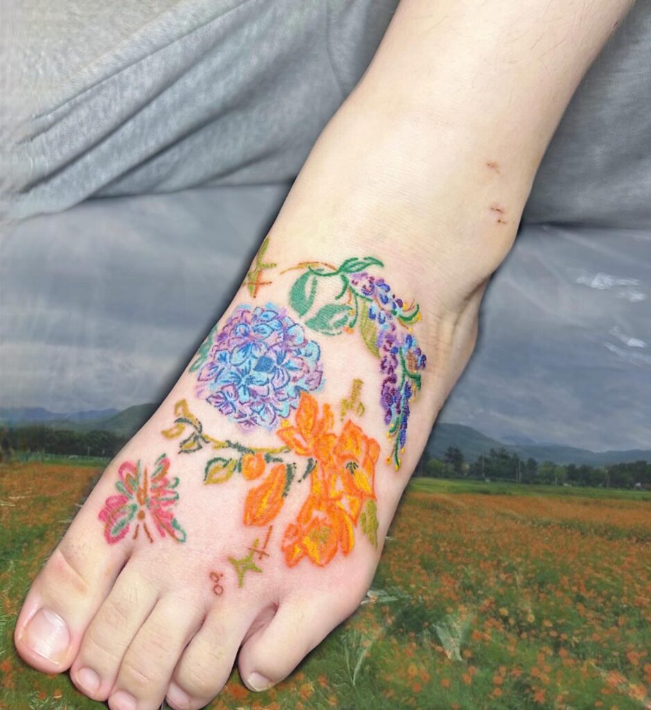 Bold Floral Foot And Ankle Tattoo With Intricate Mandala Accents