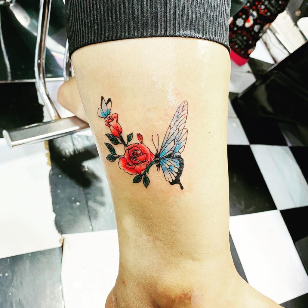 Vibrant Rose and Butterfly Wing Tattoo half butterfly half flower tattoos tattoo