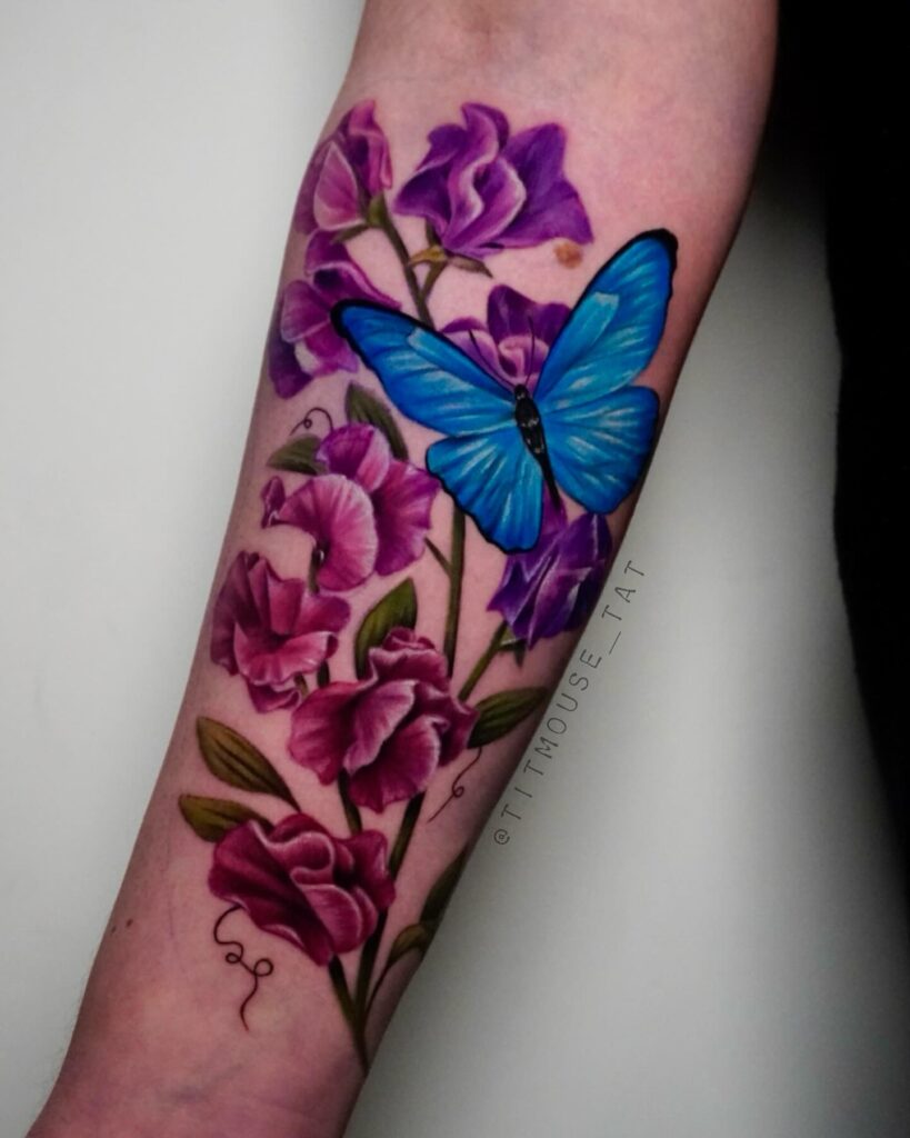 Vibrant Sweet Pea and Butterfly Tattoo april birth flower tattoo ideas tattoo