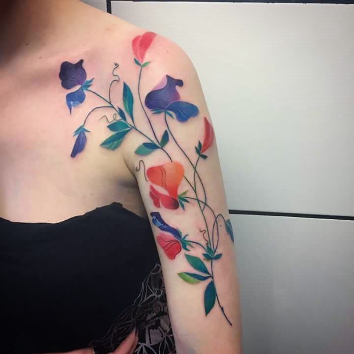 Vibrant Sweet Pea Shoulder and Arm Tattoo april birth flower tattoo ideas tattoo