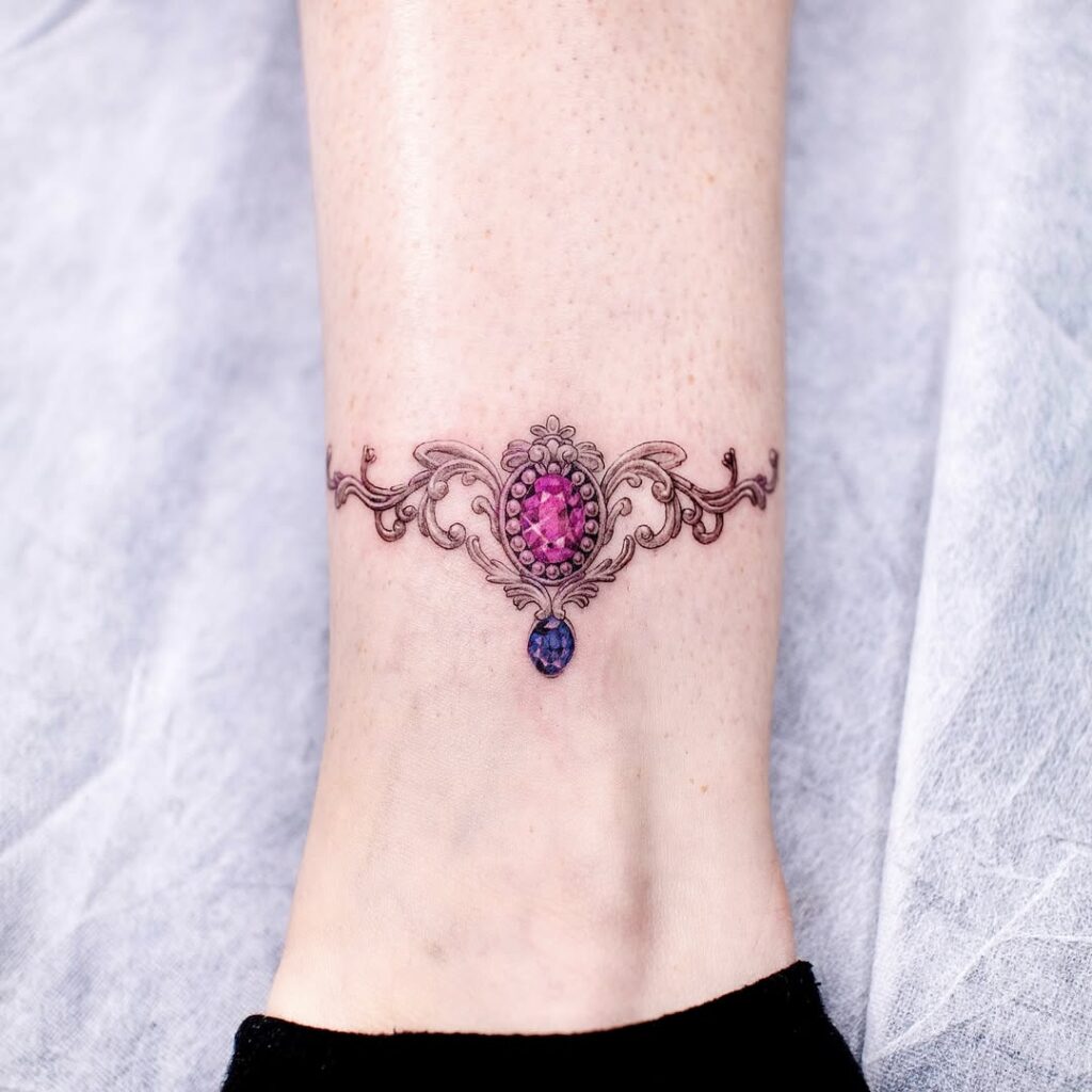 Ornamental Emerald Sternum Jewel Tattoo