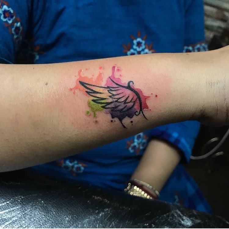 Watercolor Angel Wing Tattoo on Forearm angel wings tattoo ideas tattoo