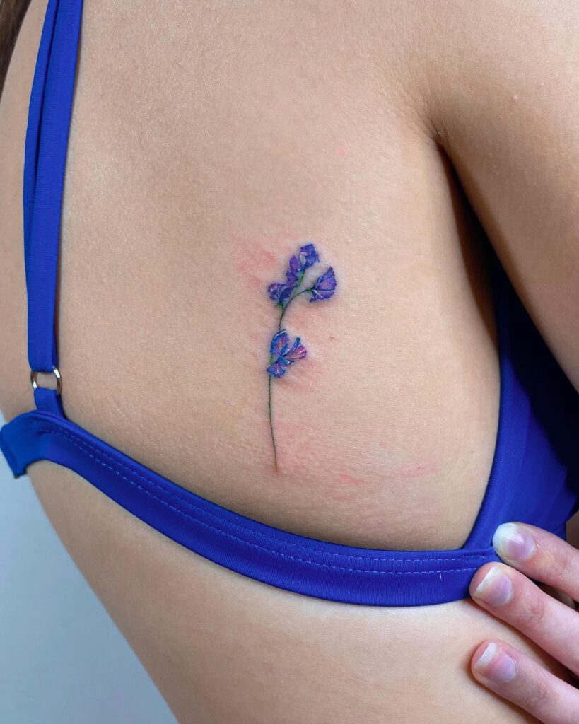 Watercolor Sweet Pea Ribcage Tattoo april birth flower tattoo ideas tattoo