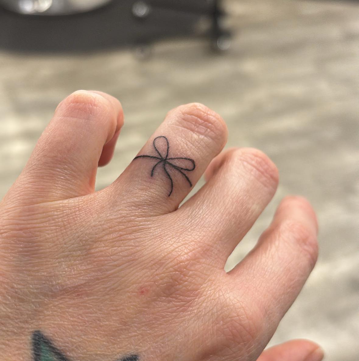 Bow Ribbon Wedding Band Tattoo