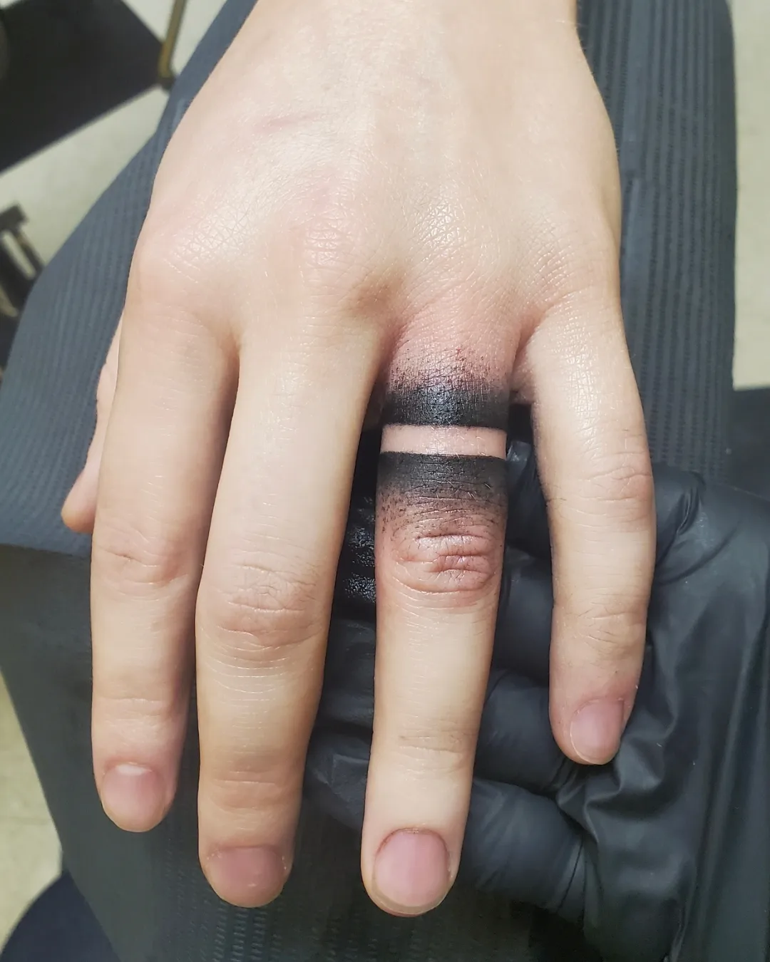 Negative Space Black Wedding Band Tattoo