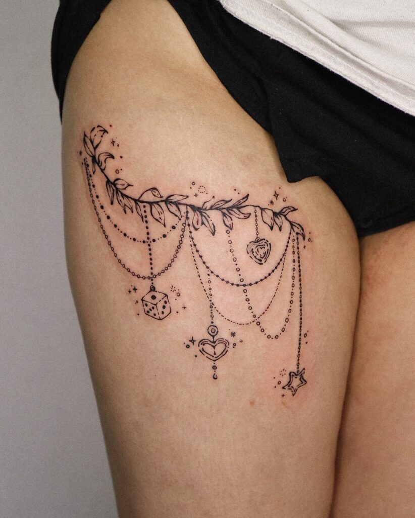 Ornamental Emerald Sternum Tattoo