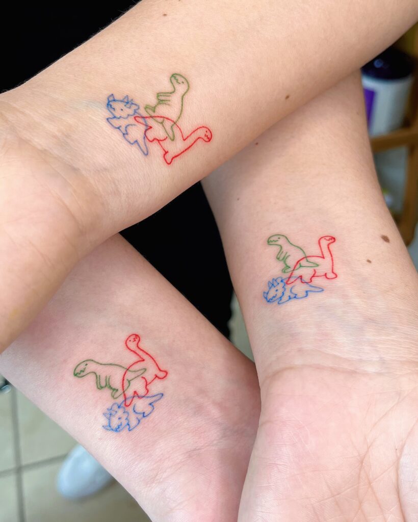 Whimsical Fine Line Dinosaurs matching family tattoo