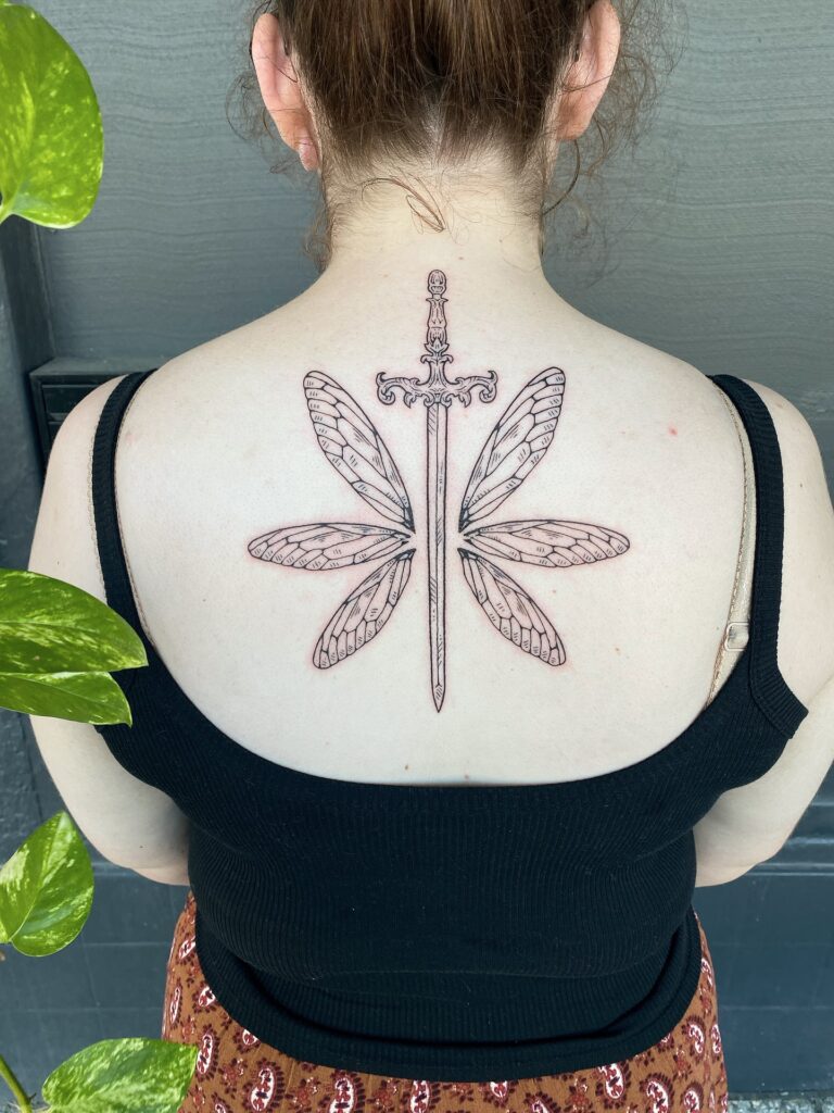 Elegant Back Tattoo With Botanical Symmetry And Deep Shading