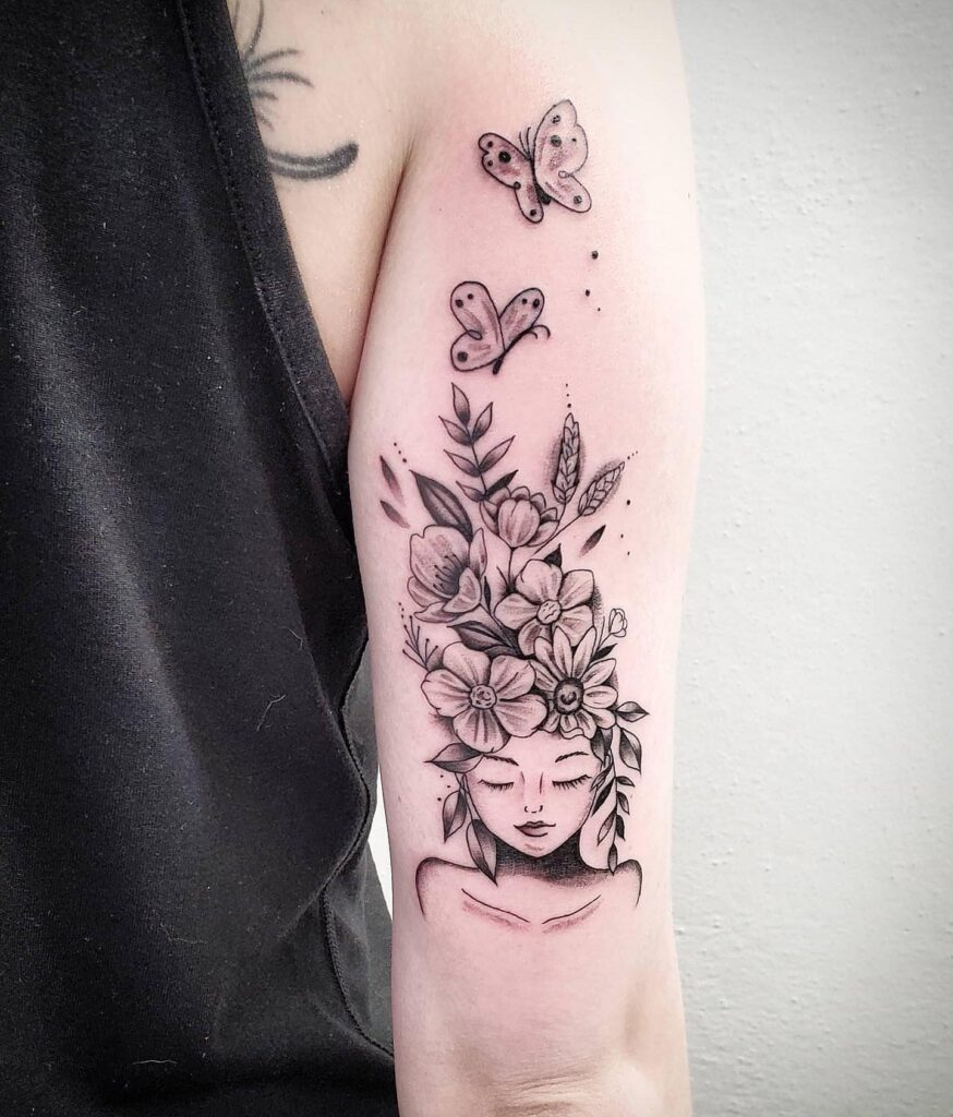 Elegant Floral Cluster With Script Upper Arm Tattoo