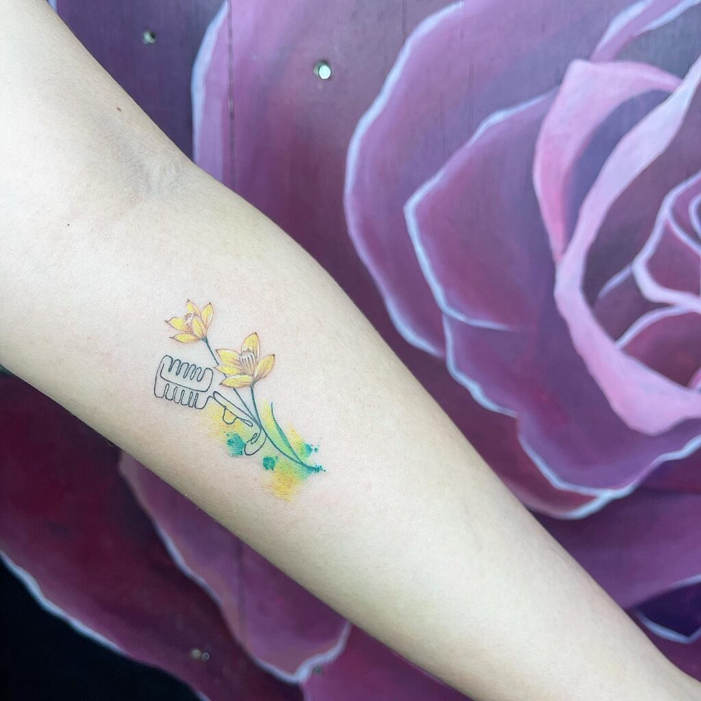 Yellow Narcissus and Microphone Tribute Tattoo december birth flower tattoo ideas tattoo