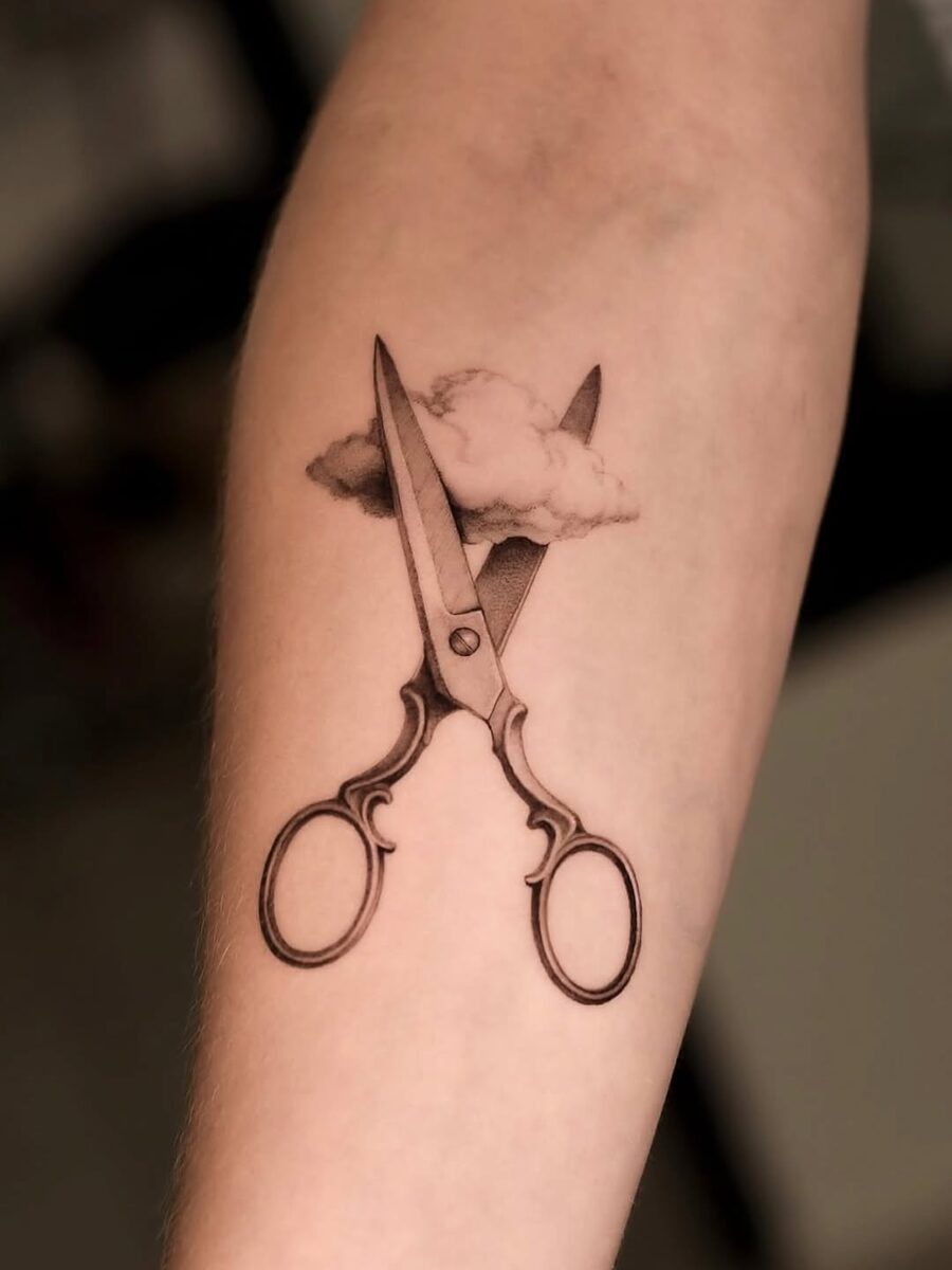 Aesthetic scissors tattoo with cloud detail Tattoo on skin