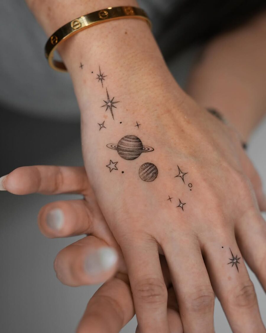 Delicate cosmic tattoo on the hand Tattoo on skin