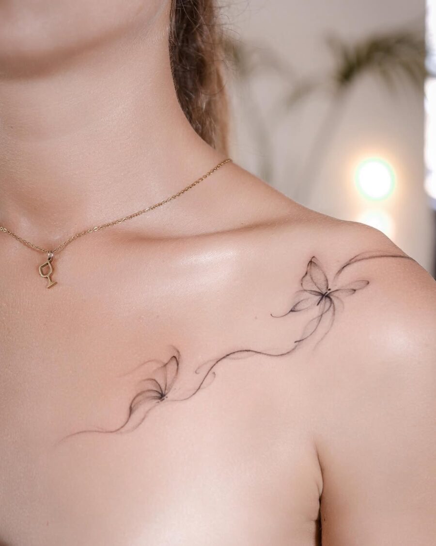 Delicate floral aesthetic tattoo on shoulder Tattoo on skin